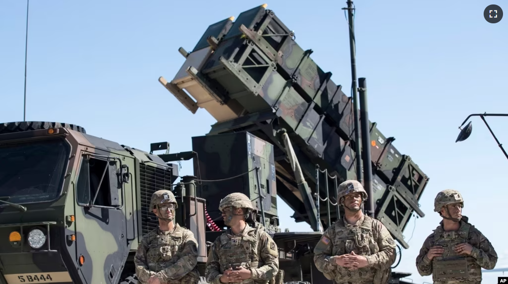 This file photo shows members of the U.S. military with a Patriot missile defense system in 2017. Ukraine says it used a system recently to shoot down a fast Russian missile. (AP Photo/Mindaugas Kulbis, File)