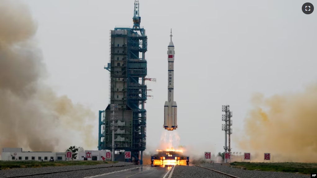 A Long March rocket carrying a crew of Chinese astronauts in a Shenzhou-16 spaceship lifts off at the Jiuquan Satellite Launch Center in northwestern China, Tuesday, May 30, 2023. (AP Photo/Mark Schiefelbein)