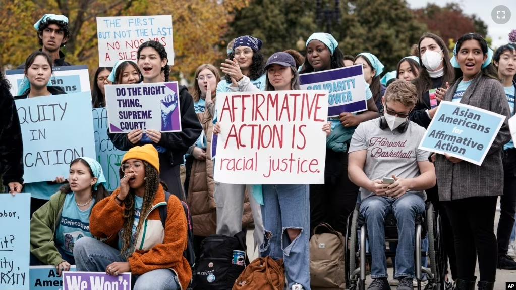 FILE - Activists demonstrate as the Supreme Court hears oral arguments on a pair of cases that could decide the future of affirmative action in college admissions, in Washington, Oct. 31, 2022. (AP Photo/J. Scott Applewhite, File)