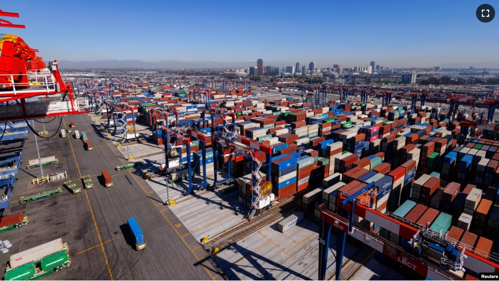 FILE - Automated electric trucks transport shipping container at the Long Beach Container Terminal in Long Beach, California, U.S., February 9, 2023. (REUTERS/Mike Blake)