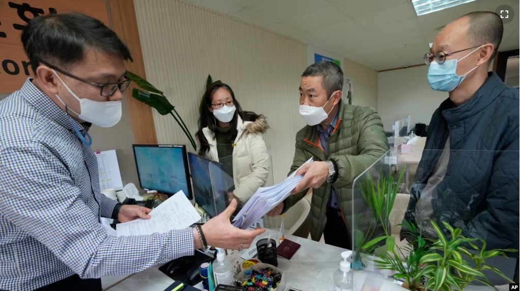 FILE - Peter Møller of the Danish Korean Rights Group submits documents at the Truth and Reconciliation Commission in Seoul on Nov. 15, 2022. (AP Photo/Ahn Young-joon, File)