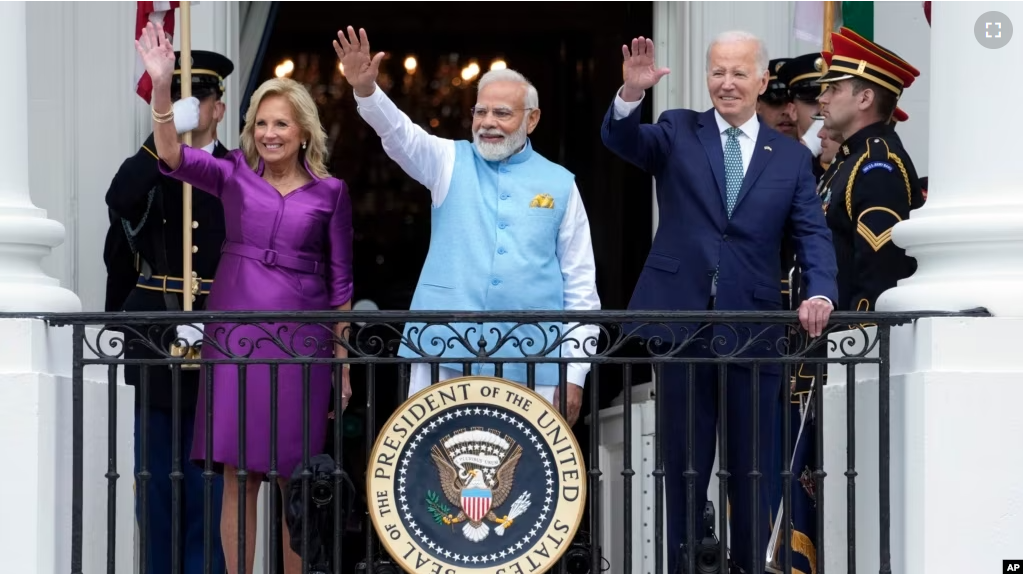 First lady Jill Biden, India's Prime Minister Narendra Modi and President Joe Biden waves from the Blue Room Balcony during an Arrival Ceremony on the South Lawn of the White House, Thursday, June 22, 2023, in Washington. (AP Photo/Manuel Balce Ceneta)