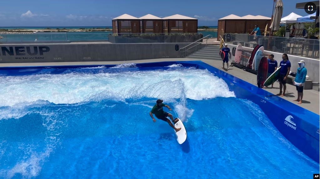 Ikaika Kaulukukui surfs in a wave pool in Ewa Beach, Hawaii, on May 9, 2023. (AP Photo/Jennifer Sinco Kelleher)