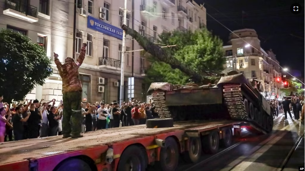 Members of the Wagner Group military company load their tank onto a truck on a street in Rostov-on-Don, Russia, Saturday, June 24, 2023, prior to leaving an area at the headquarters of the Southern Military District. (AP Photo, File)