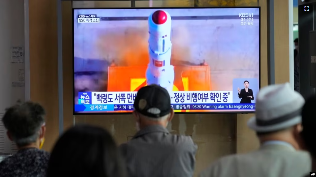 A TV screen shows a file image of North Korea's rocket launch during a news program at the Seoul Railway Station in Seoul, South Korea, Wednesday, May 31, 2023. (AP Photo/Ahn Young-joon)