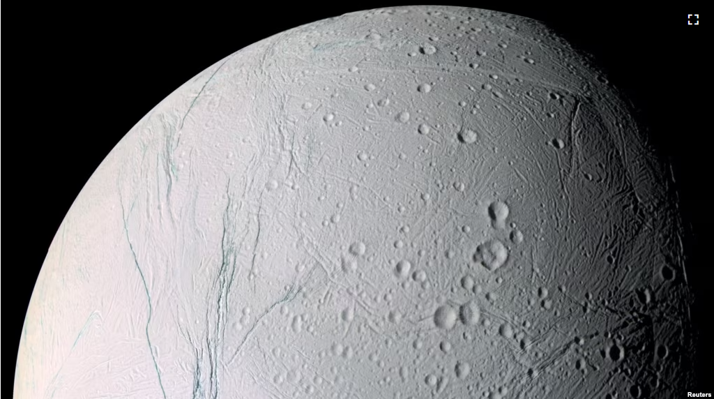 A mosaic image of Saturn's moon Enceladus shows the long fissures in the moon's icy crust at its south pole that allows water from the subsurface ocean to spew into space. (NASA/JPL/Space Science Institute/Handout via REUTERS)