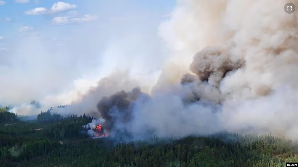 FILE PHOTO: Smoke rises above the southeast perimeter of the Paskwa fire as it burns near Fox Lake, Alberta, Canada May 16, 2023. Alberta Wildfire/Handout via REUTERS