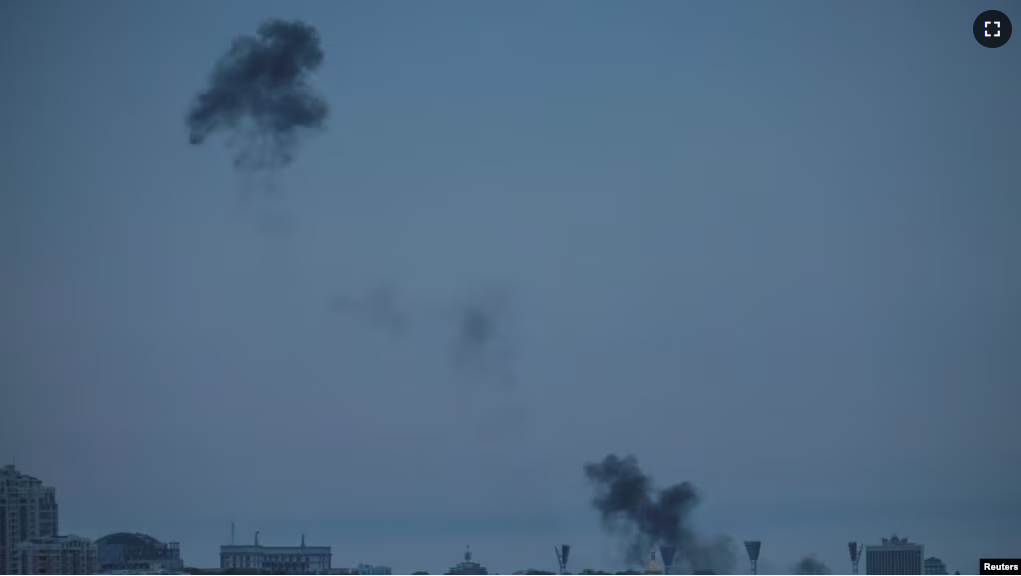 Smoke rises over the city after the remains of a shot-down drone landed on the ground, amid Russia's attack on Ukraine, in Kyiv, May 4, 2023.