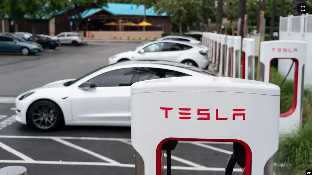 FILE - Tesla vehicles are charged at a charging station in Anaheim, Calif., Friday, June 9, 2023. Owners of General Motors and Ford electric vehicles will be able charge at many of Tesla's large network of stations across the U.S. starting next year. (AP Photo/Jae C. Hong)