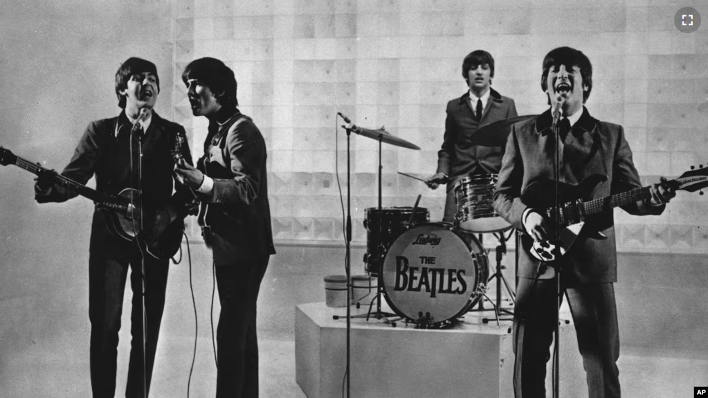 FILE - The Beatles are seen performing, date unknown. From left to right: Paul McCartney, George Harrison, Ringo Starr, and John Lennon. (AP Photo)