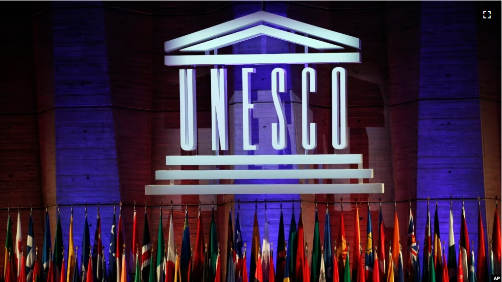 FILE - In this Nov.4, 2017 file photo, the logo of the United Nations Educational, Scientific and Cultural Organisation (UNESCO) is seen during the 39th session of the General Conference at the UNESCO headquarters in Paris. (AP Photo/Christophe Ena, File)