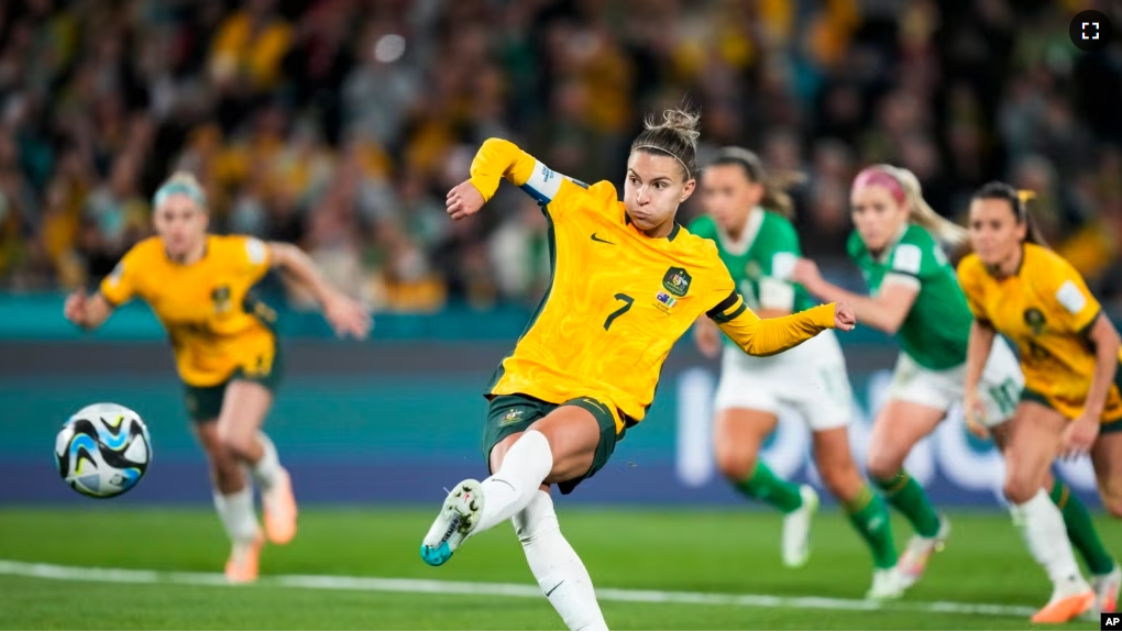 Australia's Steph Catley shoots a penalty kick to score the opening goal during the Women's World Cup soccer match between Australia and Ireland at Stadium Australia in Sydney, Australia, Thursday, July 20, 2023. (AP Photo/Rick Rycroft)