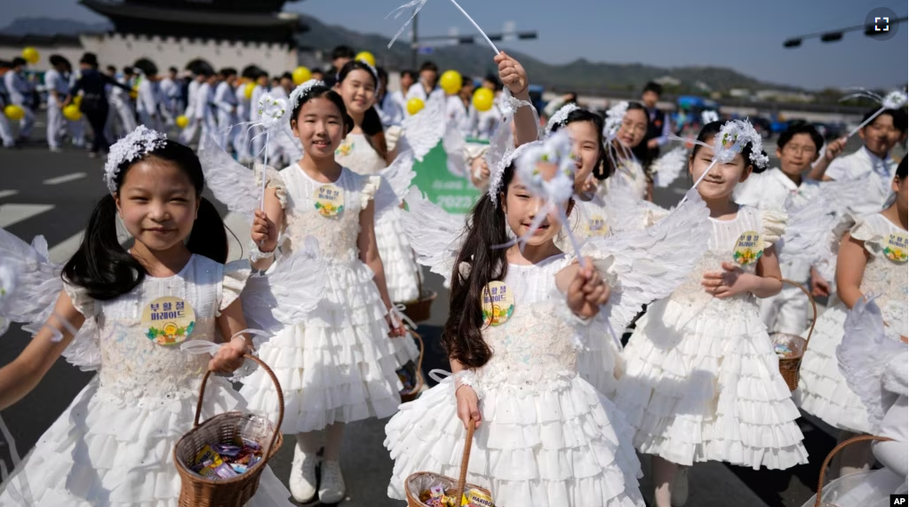 FILE - Children dressed as angels march during an Easter parade in Seoul, South Korea, on April 9, 2023. (AP Photo/Lee Jin-man, File)