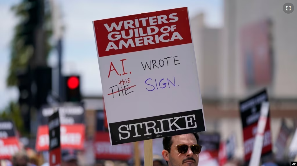 FILE - Members of the The Writers Guild of America picket outside Fox Studios on Tuesday, May 2, 2023, in Los Angeles. (AP Photo/Ashley Landis, File)