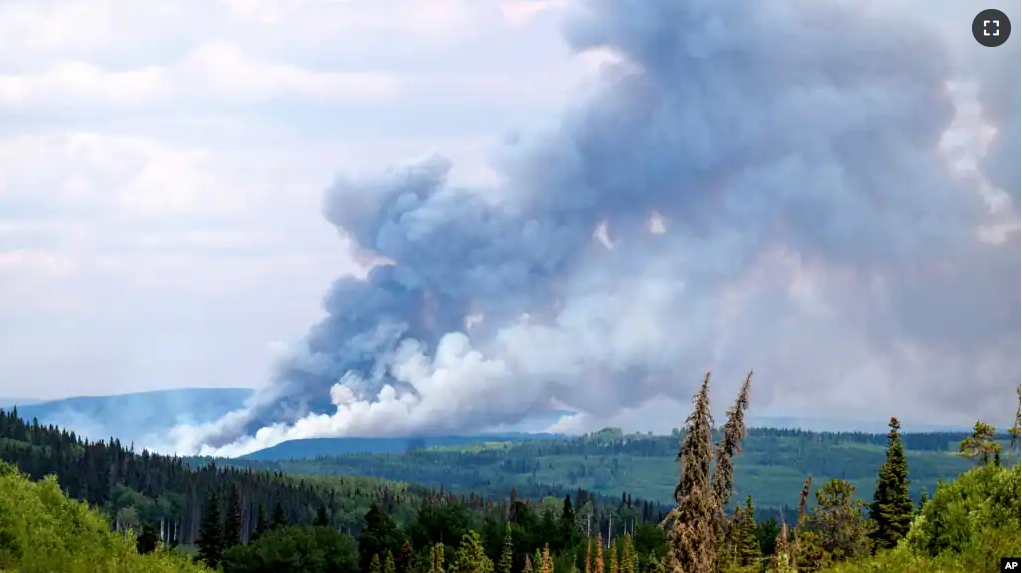 FILE - Smoke billows from the Donnie Creek wildfire burning north of Fort St. John, British Columbia, Canada, Sunday, July 2, 2023. (AP Photo/Noah Berger, File)