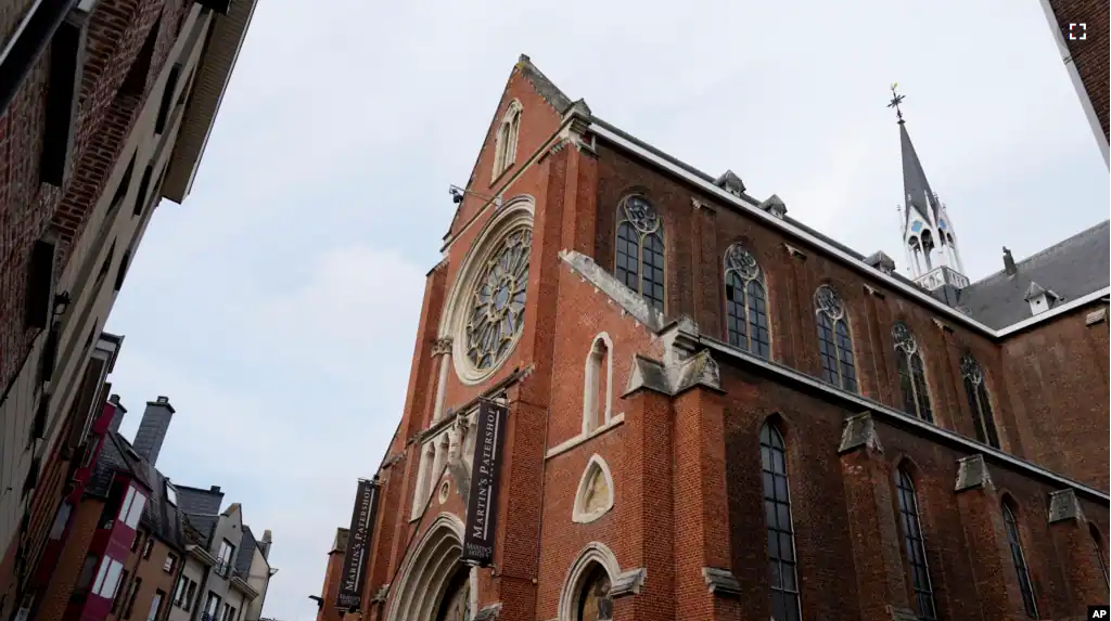 The exterior of the Martin's Patershof hotel in the center of Mechelen, Belgium, Monday, June 19, 2023. Across Europe, churches have opened up to non-religious activities to expand their use. (AP Photo/Virginia Mayo)