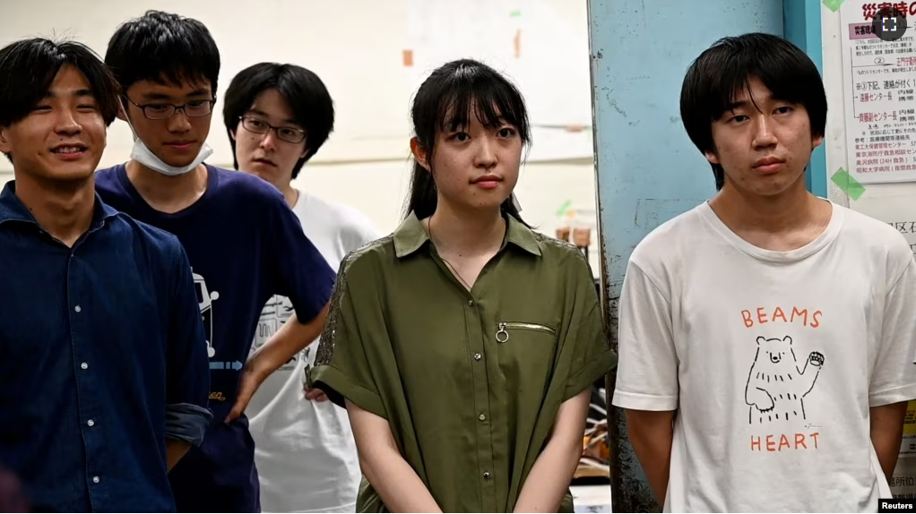 Yuna Kato works with male students at her college club to produce a light human-powered aircraft at the school, at Tokyo University in Tokyo, Japan on June 30, 2023, in this screen grab from video. (REUTERS/Chris Gallagher)