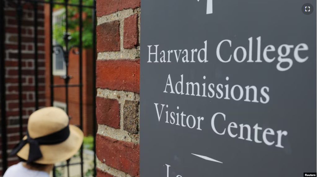 FILE - A sign points the way to the Harvard College Admissions Visitors Center at Harvard University in Cambridge, Massachusetts, U.S., July 6, 2023. (REUTERS/Brian Snyder)