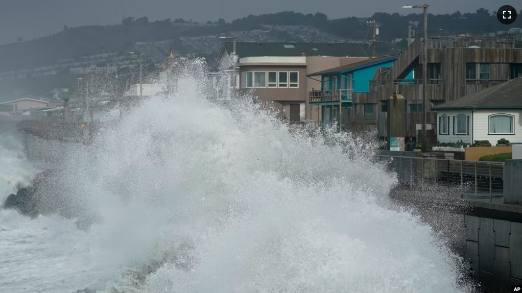 FILE - Large waves crash into a seawall in Pacifica, Calif., on Jan. 6, 2023. New data permits researchers to follow the growth of big waves over 90 years. (AP Photo/Jeff Chiu, File)