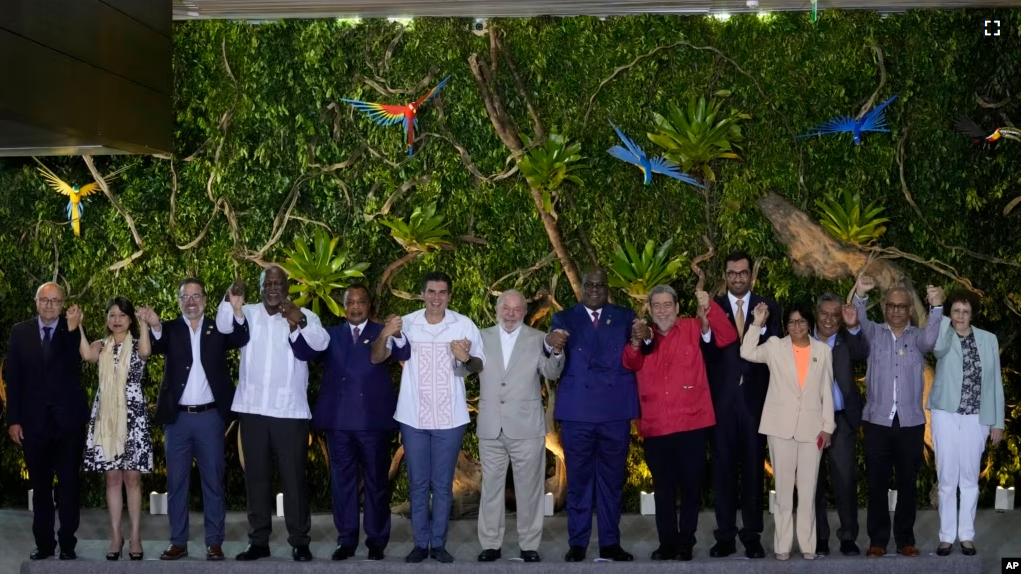 Leaders pose for a group photo during the Amazon Summit at the Hangar Convention Center in Belem, Brazil, Wednesday, Aug. 9, 2023. (AP Photo/Eraldo Peres)