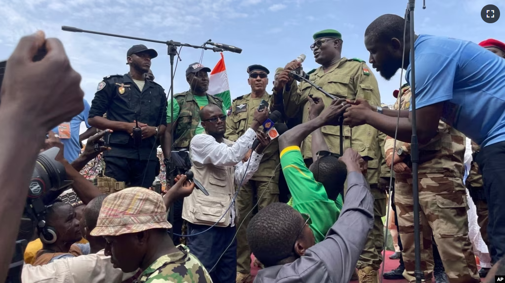 Mohamed Toumba, one of the soldiers who ousted Nigerian President Mohamed Bazoum, addresses supporters of Niger's ruling junta in Niamey, Niger, Sunday, Aug. 6, 2023. (AP Photo/Sam Mednick)