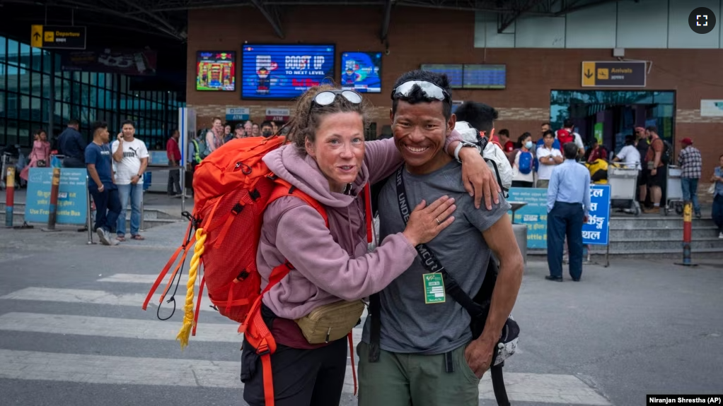 Norwegian climber Kristin Harila, 37, right, and her guide Tenjen Sherpa pose for a photograph in Kathmandu, Nepal, Tuesday, June 6, 2023. (AP Photo/Niranjan Shrestha)