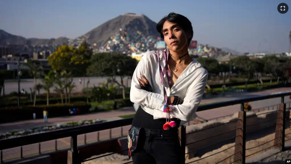 Peruvian singer Lenin Tamayo poses for a photo while taking a break from recording a music video in downtown Lima, Peru, Thursday, Aug. 3, 2023. (AP Photo/Martin Mejia)