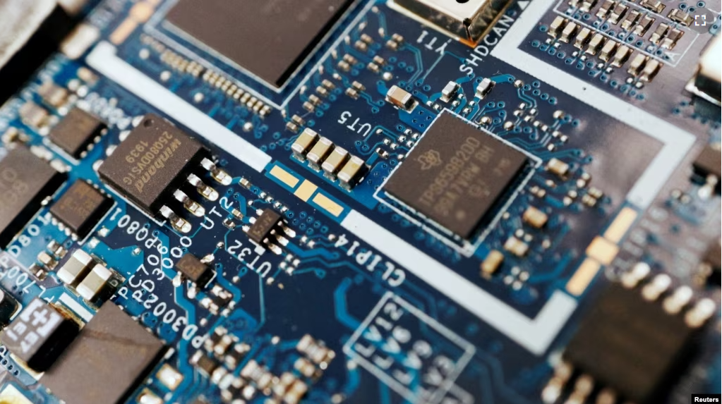 FILE - Semiconductor chips are seen on a circuit board of a computer in this illustration picture taken February 25, 2022. (REUTERS/Florence Lo/Illustration)