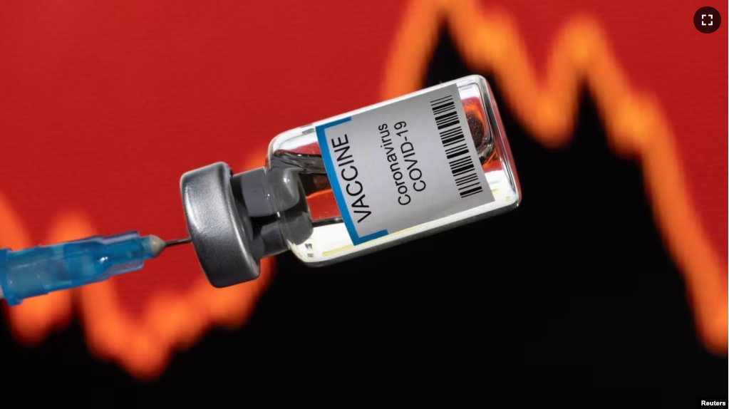 FILE - A vial labelled "VACCINE Coronavirus COVID-19" is seen in front of a stock graph in this illustration taken on January 17, 2022. (REUTERS/Dado Ruvic/Illustration)