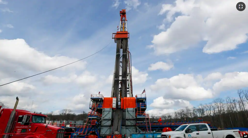 FILE - Work continues at a shale gas well drilling site in St. Mary's, Pa., March 12, 2020.(AP Photo/Keith Srakocic, File)