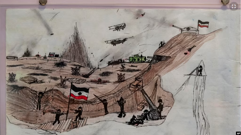 A drawing by Mykola Kostenko is part of the War Diaries exhibition, showcasing the personal diaries of Ukrainian children who have witnessed the war, hosted by the Amsterdam city hall , Netherlands, Thursday, Aug. 17, 2023. (AP Photo/Peter Dejong)