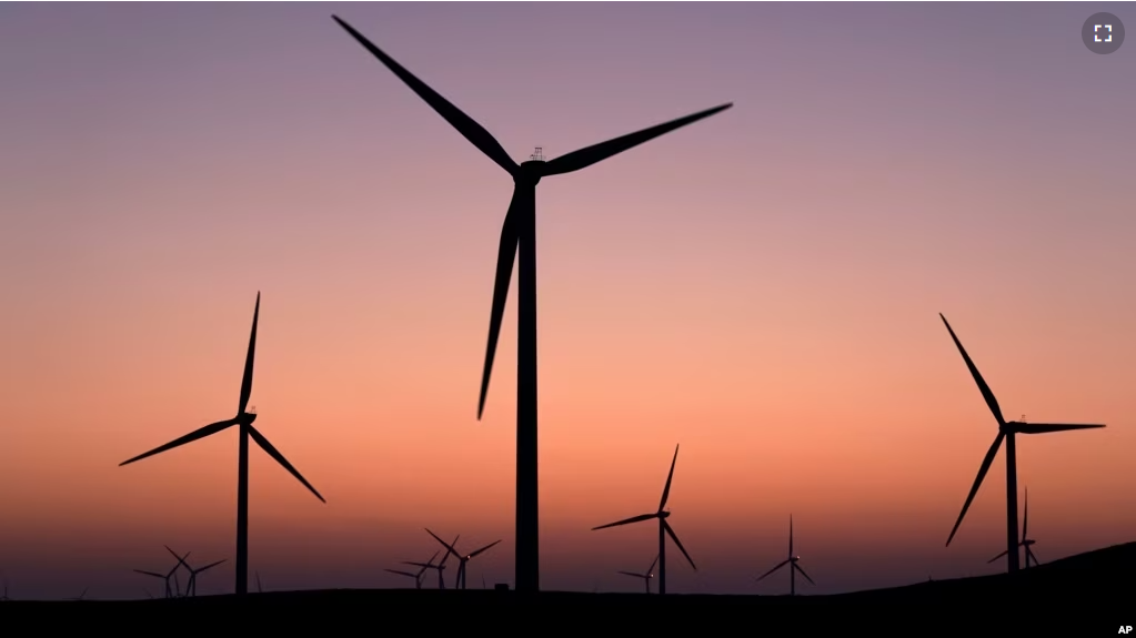 A wind farm is seen at dusk in rural Solano County, Calif., Wednesday, Aug. 30, 2023. (AP Photo/Godofredo A. Vásquez)