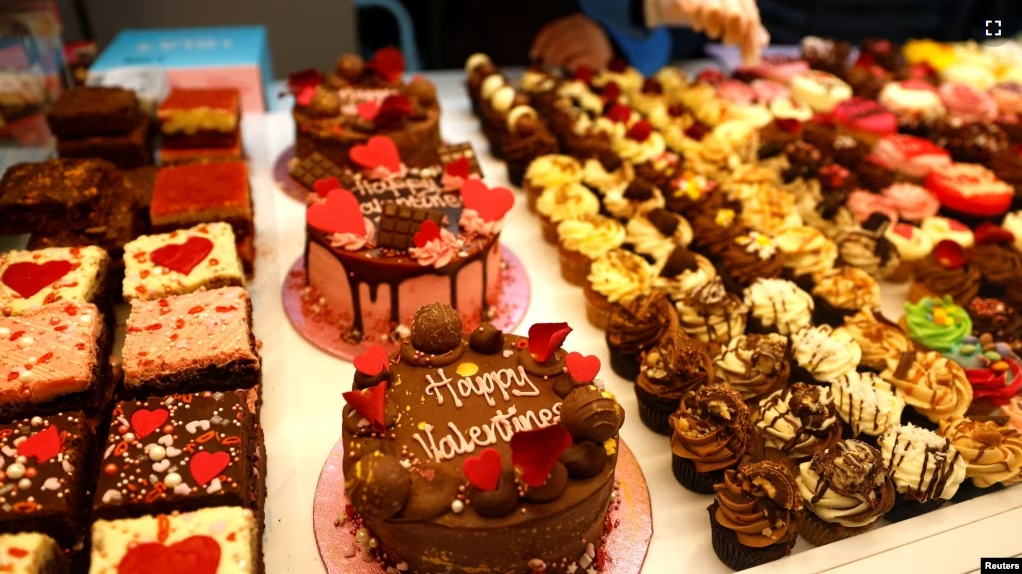 FILE - Cakes with different icing and flavors are for sale ahead of Valentine's Day in London, Britain, February 13, 2023. (REUTERS/Peter Nicholls)