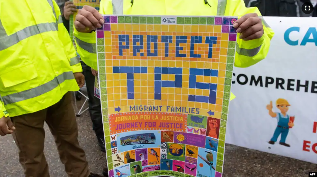 FILE - Demonstrators participate in the March for TPS (Temporary Protected Status) Justice during a protest in support of permanent residency, outside the White House in Washington, Feb. 12, 2019. (Photo by SAUL LOEB / AFP)