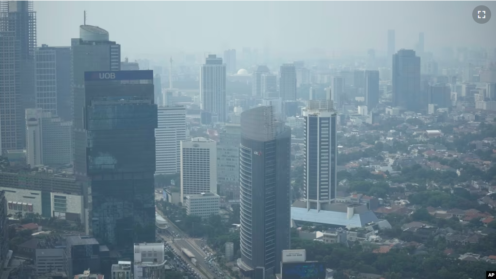 FILE - Haze blankets the main business district in Jakarta, Indonesia on August 11, 2023. (AP Photo/Dita Alangkara, File)