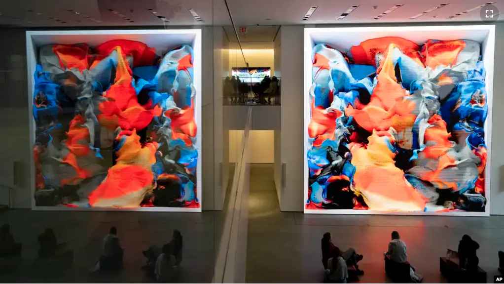 FILE - Refik Anadol's "Unsupervised" exhibit at the Museum of Modern Art, Wednesday, Jan. 11, 2023, in New York. The new AI-generated installation is meant to be a thought-provoking interpretation of New York. (AP Photo/John Minchillo)