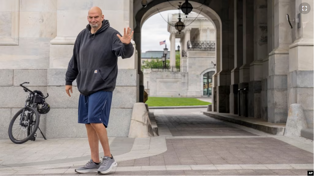 FILE - Sen. John Fetterman, D-Pa., waves to members of the media on April 17, 2023, on Capitol Hill in Washington. (AP Photo/Jacquelyn Martin, File)