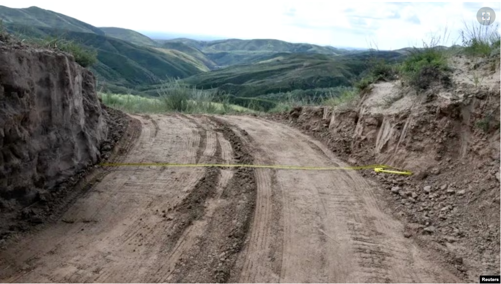 View of a dirt road passing through a damaged section of the Great Wall of China, in Youyu County, Shuozhou City, Shanxi Province, China, in this still image released on August 31, 2023. (Youyu County Public Security Bureau/Handout via REUTERS)