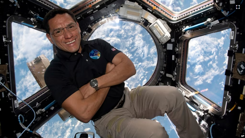 This image provided by NASA shows astronaut Frank Rubio floating inside the cupola, the International Space Station’s “window to the world.” Rubio now holds the record for the longest U.S. spaceflight. (NASA via AP)