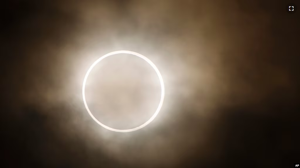 FILE - An annular eclipse at a waterfront park in Yokohama, near Tokyo, Monday, May 21, 2012. (AP Photo/Shuji Kajiyama)