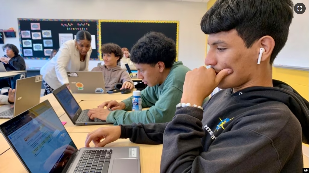 Bryan Martinez, a senior at Capital City Public Charter School in Washington, works on a computer during his Advanced Algebra with Financial Applications class on Sept. 12, 2023. (Jackie Valley/The Christian Science Monitor via AP)