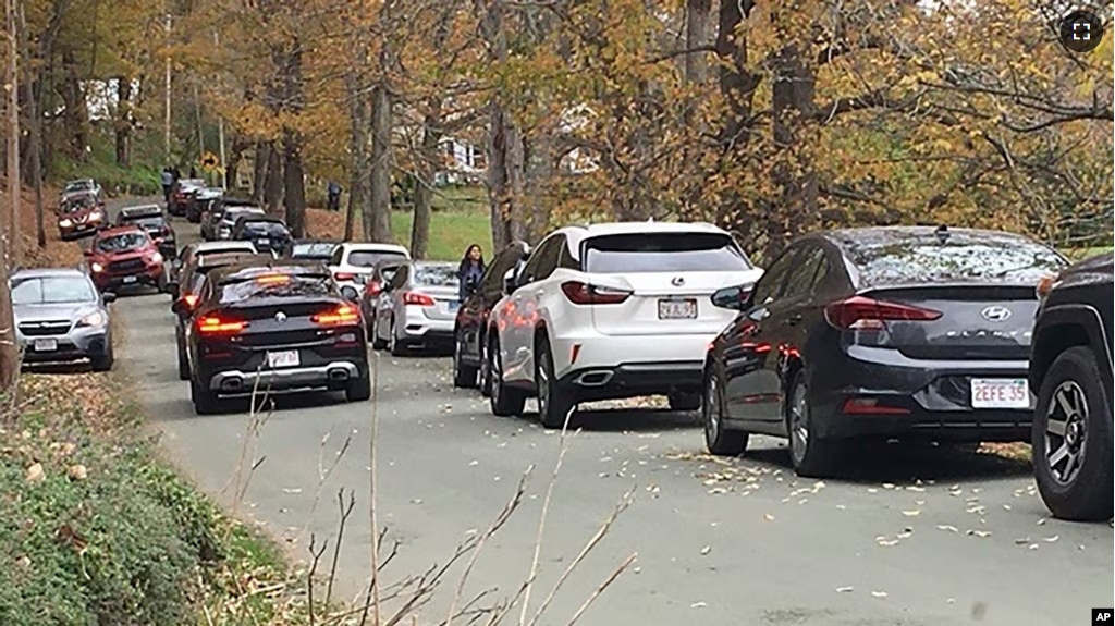 Cars line a narrow road outside a private property in an undated photo, in Pomfret, Vt., that has become a destination for fall foliage viewers, clogging the rural road. (AP Photo)