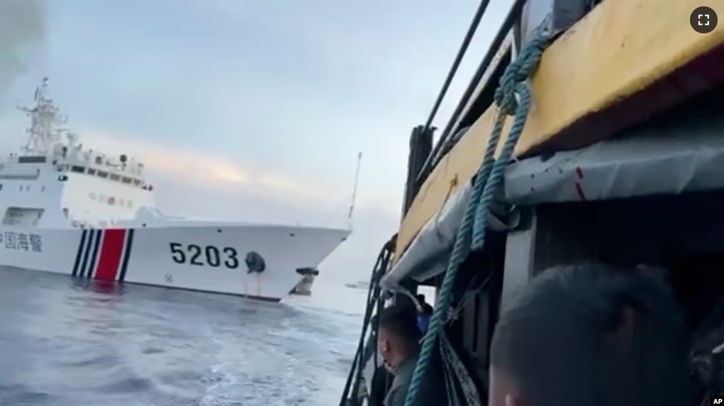 This image shows Filipino sailors look after a Chinese coast guard ship with bow number 5203 bumps their supply boat as they approach Second Thomas Shoal, in the South China Sea on Sunday Oct. 22, 2023. (Armed Forces of the Philippines via AP)