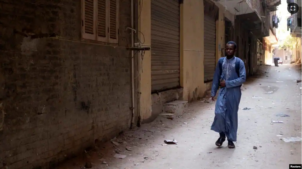 Mamadou Safaiou Barry, a 25-year-old from Guinea, walks to the center where he studies Islam and the Koran, in El Marg district, east of Cairo, Egypt, September 23, 2023. (REUTERS/Fatma Fahmy)