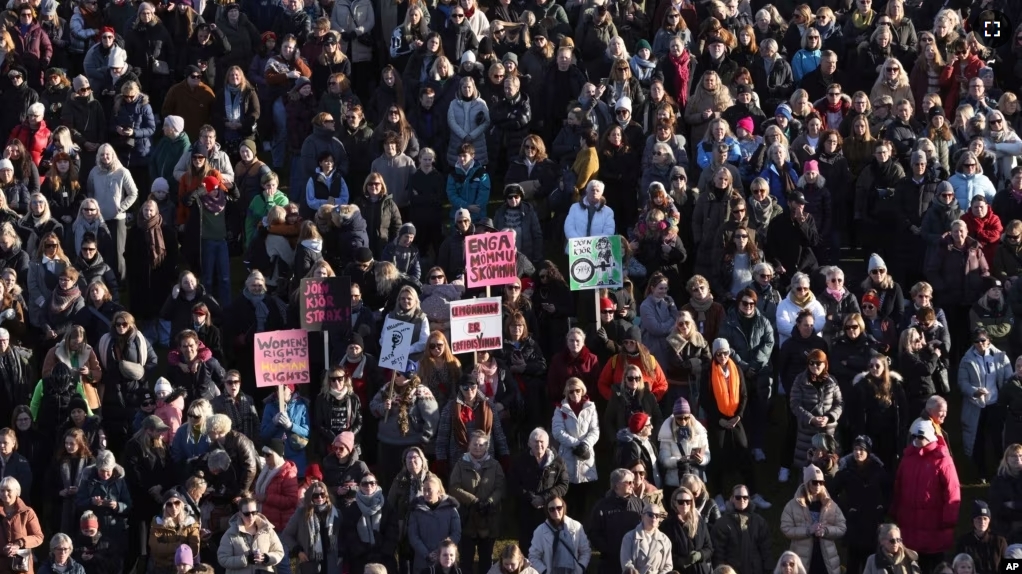 People across Iceland gather during the women's strike in Reykjavik, Iceland, Tuesday, Oct. 24, 2023. (AP Photo/Arni Torfason)