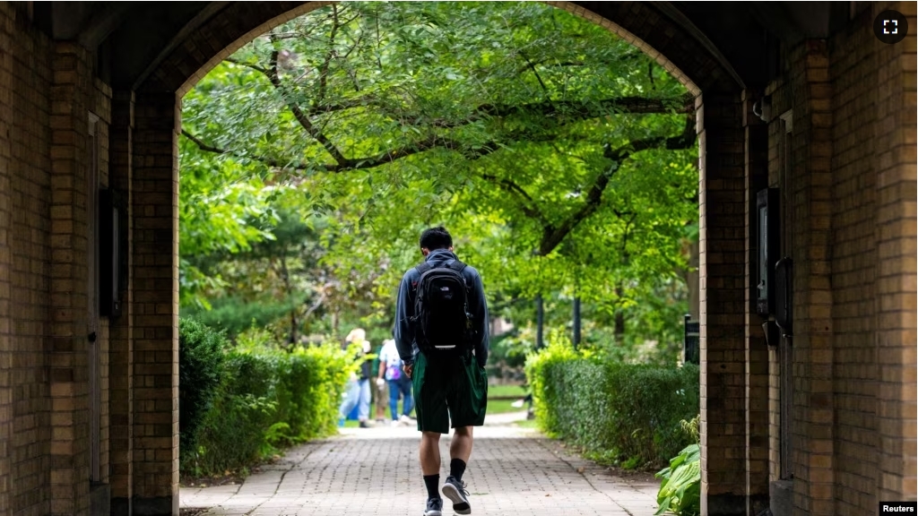 FILE - People walk on the grounds of the University of Toronto in Toronto, Ontario, Canada September 9, 2020. (REUTERS/Carlos Osorio/File Photo)