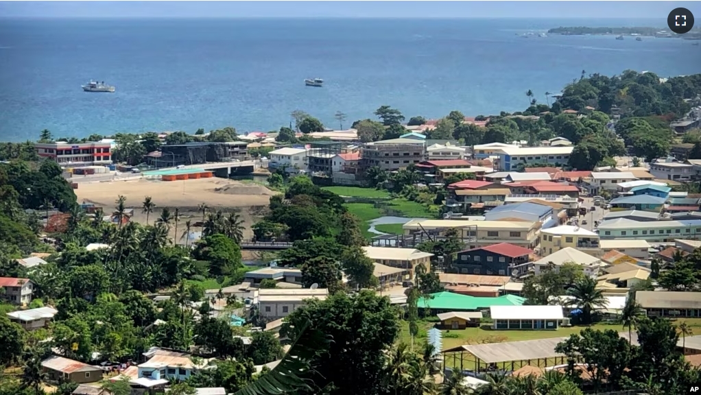 FILE - Ships are docked offshore near Honiara, the capital of the Solomon Islands, Nov. 24, 2018. Google will work together with the United States and Australia to offer internet service to Pacific Island nations. (AP Photo/Mark Schiefelbein, File)