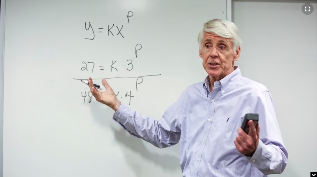 FILE - Teacher Jerry Howland explains an equation during the Bridge to Calculus summer program at Northeastern University in Boston on Tuesday, Aug. 1, 2023. (AP Photo/Reba Saldanha)