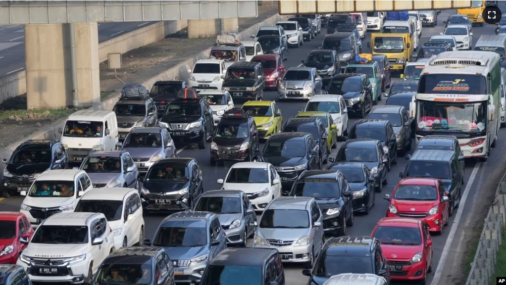 FILE - Vehicles are caught in congestion as the flow of traffic increases at toll road in Cikarang, West Java, Indonesia, Friday, April 29, 2022. Google says its AI-powered system helps improve traffic flow. (AP Photo/Achmad Ibrahim)