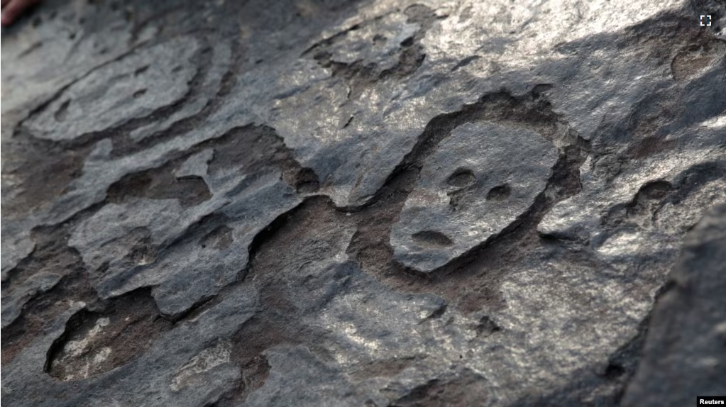 FILE - A view of ancient stone carvings on a rocky point of the Amazon river that were exposed after water levels dropped to record lows during a drought in Manaus, Amazonas state, Brazil October 23, 2023. (REUTERS/Suamy Beydoun)